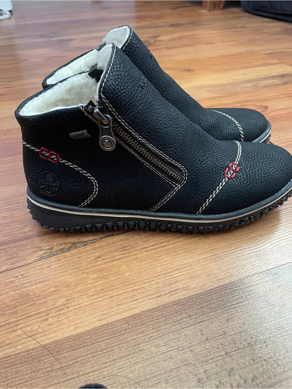 Rieker Women’s Black Faux-Fur Lined Zip Ankle Boots with Red Stitching